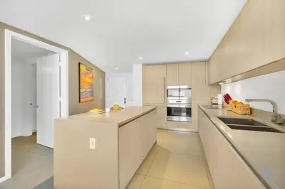 a kitchen with a sink and a counter top at Insane Ocean View Balcony, Beachfront Resort, Pool in Hollywood