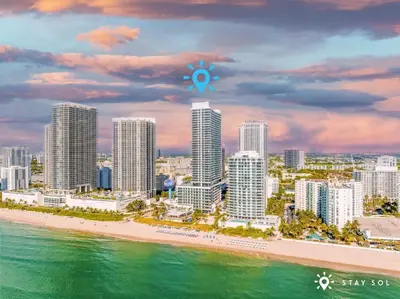 a view of a city with a beach and buildings at Insane Ocean View Balcony, Beachfront Resort, Pool in Hollywood