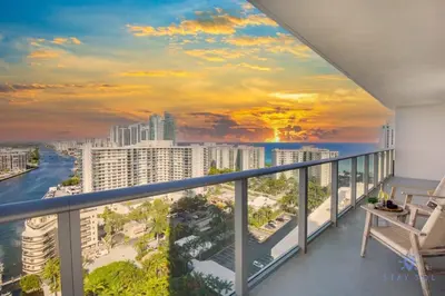 a balcony with a view of the ocean and buildings at High Floor with Stunning Views, Amazing Pools in Hollywood