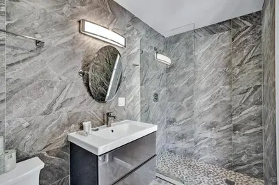 a bathroom with a sink and a mirror at Spectacular 5BR & 5BA Villa in Hollywood Lakes in Hollywood