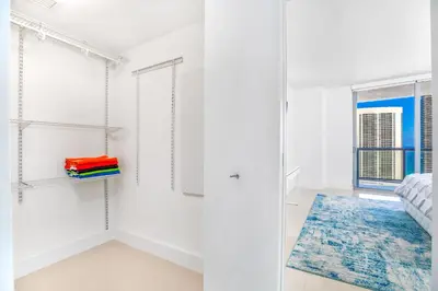 a white room with a bed and a window at Beachwalk Resort - Waterfront huge 3-Bedroom apartment with direct ocean-view! in Hallandale Beach