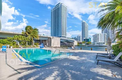 a swimming pool with a view of the city at Beachwalk Resort - Waterfront huge 3-Bedroom apartment with direct ocean-view! in Hallandale Beach