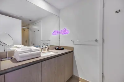 a bathroom with a sink and a mirror at Hyde Resort Beachfront Condo #1904 - GORGEOUS 2BD & 2BA APT WITH OCEAN VIEW in Hollywood