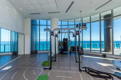 a gym with cardio equipment in a building with windows at Hyde Resort Beachfront Condo #1904 - GORGEOUS 2BD & 2BA APT WITH OCEAN VIEW in Hollywood