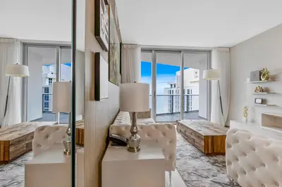 a living room with white furniture and large windows at Hyde Resort Beachfront Condo #1904 - GORGEOUS 2BD & 2BA APT WITH OCEAN VIEW in Hollywood