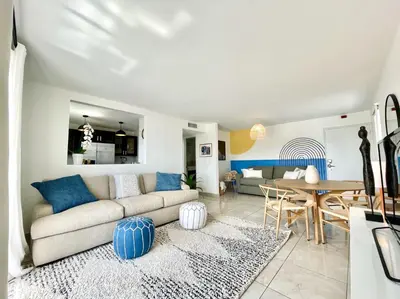 a living room with a couch and a table at Large 1 bedroom apartment with free private parking in Miami Beach