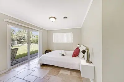 a bedroom with a bed and a large window at Home wpool by PMI unit 332 in Fort Lauderdale