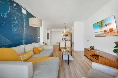 a living room with a couch and a table at Amazing Pool - Gym - Complementary Shuttle in Hallandale Beach