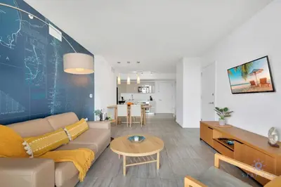 a living room with a couch and a dining room at Infinite View, Balcony with Gym and Amazing Pool in Hallandale Beach