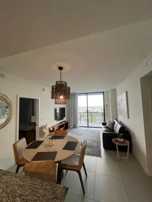 a living room with a table and a couch at APARTMENT FOR RENT 2 BED 2 BATH 1 Parking DOWNTOWN DORAL in Miami