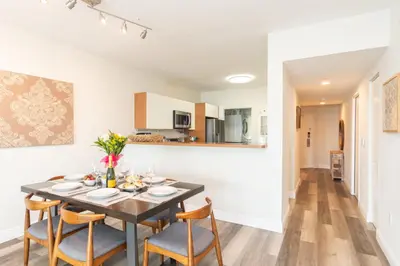 a kitchen and dining room with a table and chairs at Marina Bay 406 in Miami Beach