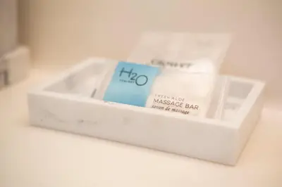 a white box filled with massage bars on a table at Marina Bay 406 in Miami Beach