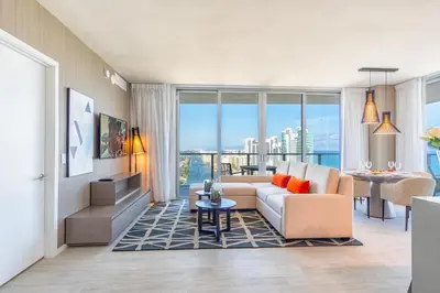 a living room with a couch and a table at Hyde Beach House 2601 in Hollywood