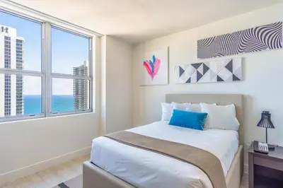 a bedroom with a bed and a large window at Hyde Beach House 2601 in Hollywood