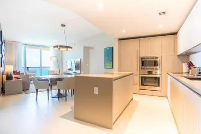 a kitchen and dining room with a table and chairs at Lyfe Beach Resort 3804 in Hollywood Beach