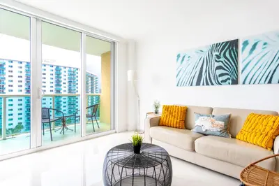 a living room with a couch and a table at Ocean Reserve 1006 in Miami Beach