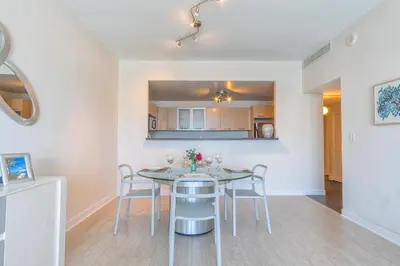 a kitchen and dining room with a table and chairs at Ocean Reserve PH6 in Miami Beach