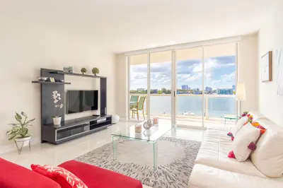 a living room with a couch and a glass table at Golden Bay 408 in Miami Beach