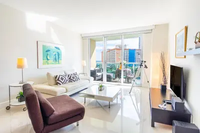 a living room with a couch and a table at Ocean Reserve 725 in Miami Beach