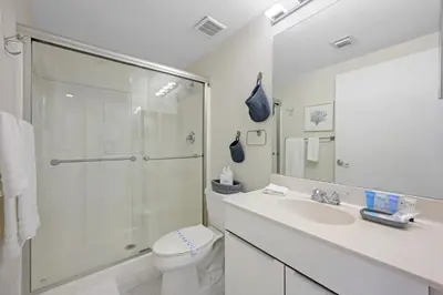 a bathroom with a shower and a toilet and a sink at Golden Bay 506 in Miami Beach