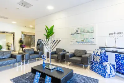 a waiting room with couches and a table at Ocean Reserve 1112 in Miami Beach