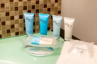 a group of four products sitting on a counter at Golden Bay 805 in Miami Beach