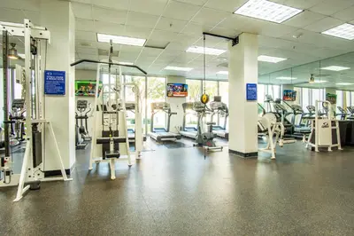a gym with several treadmills and tread machines at Ocean Reserve 1404 in Miami Beach