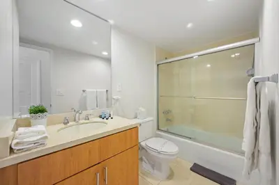 a bathroom with a sink and a toilet and a shower at Ocean Reserve 1616 in Miami Beach