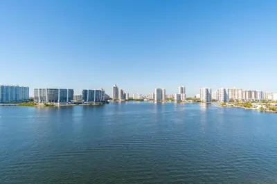 a large body of water with a city in the background at Marina Bay 1103 in Miami Beach