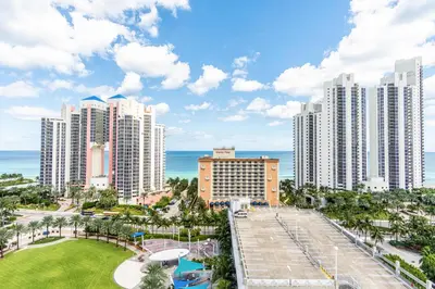 a view of a city with tall buildings and the ocean at Ocean Reserve PH1 in Miami Beach