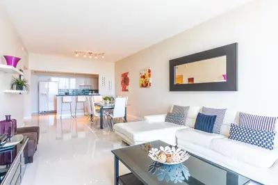 a living room with a couch and a table at Ocean Reserve PH1 in Miami Beach