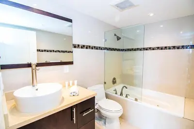 a bathroom with a sink and a toilet and a shower at Ocean Reserve 818 in Miami Beach