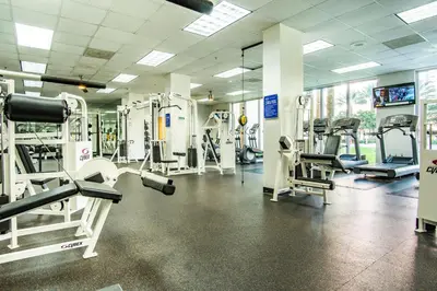 a gym with several treadmills and machines at Ocean Reserve 818 in Miami Beach