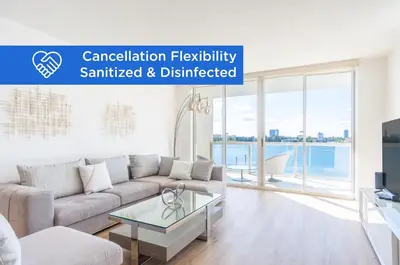 a living room with a couch and a table at Golden Bay 502 in Miami Beach