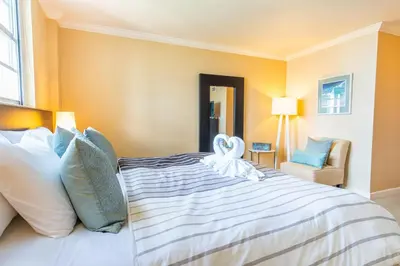 a bedroom with a large bed with a towel on it at Ocean Reserve 1515 in Miami Beach