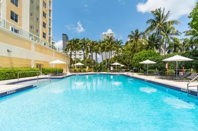 a large swimming pool in front of a building at Golden Bay 509 in Miami Beach