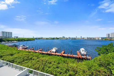 a dock with boats on it on a river at Golden Bay 509 in Miami Beach