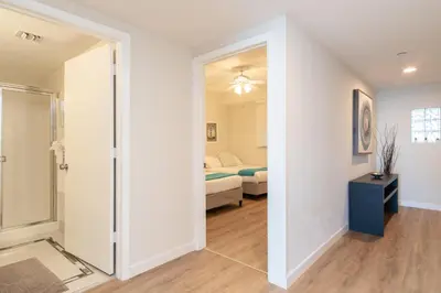 a room with a glass door leading to a bedroom at Golden Bay 602 in Miami Beach