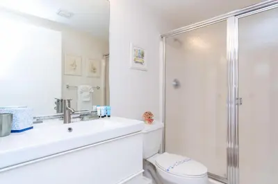 a bathroom with a shower and a sink and a toilet at Golden Bay 602 in Miami Beach