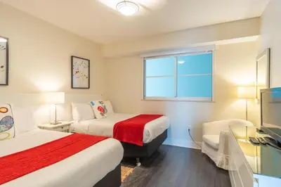 a hotel room with two beds and a window at Golden Bay 302 in Miami Beach