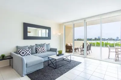 a living room with a couch and a table at Golden Bay 302 in Miami Beach