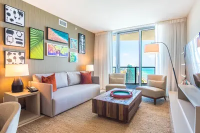 a living room with a couch and a table at Lyfe Beach Resort 3604 in Hollywood Beach
