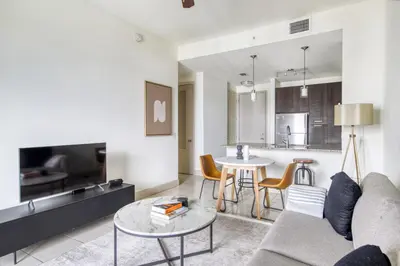 a living room with a couch and a table at Doral 1BR w wd pool gym nr Airport MIA-17 in Miami