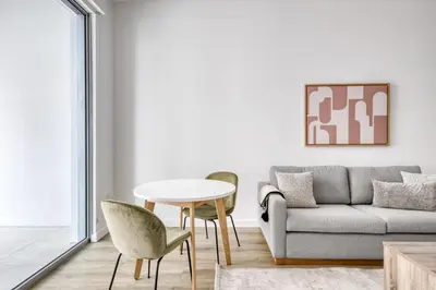 a living room with a couch and a table and chairs at Coral Gables 1BR w WD Pool Gym nr Shops MIA-9 in Miami