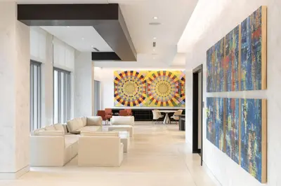 a living room with white furniture and a large painting on the wall at Coral Gables 1BR w WD Pool Gym nr Shops MIA-9 in Miami