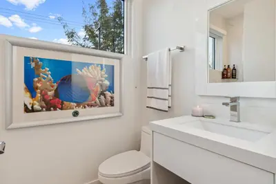 a bathroom with a white toilet and a sink at City Forest One,Brand New Living, Executive /1Gb/s in Miami