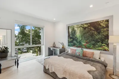 a bedroom with a large painting on the wall at City Forest One,Brand New Living, Executive /1Gb/s in Miami