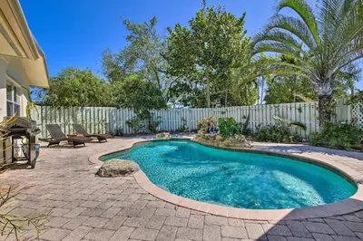 a small swimming pool in a yard with a fence at Vacation Rental with Private Pool in Wilton Manors in Fort Lauderdale