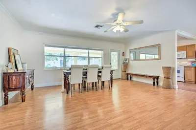 a dining room with a table and a ceiling fan at Vacation Rental with Private Pool in Wilton Manors in Fort Lauderdale