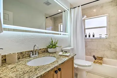 a bathroom with a sink and a toilet at Vacation Rental with Private Pool in Wilton Manors in Fort Lauderdale